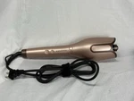 Bujiyi Automatic Curling Iron. Preowned. Used. Price: $18.00.
